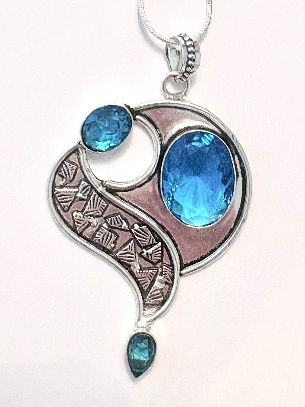 Beautiful, 3 inch, 925 marked, 3 faceted, Blue Topaz gemstone on a silver chain.